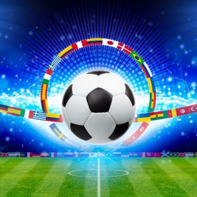 fototapeta dla dzici piłka nozna na tle stadionu w otoczeniu wszystkich flag państw