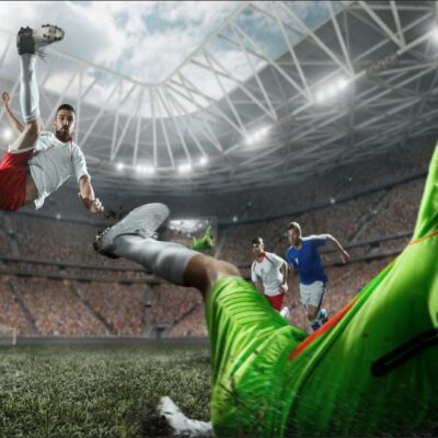 Fototapeta dla dzieci piłka piłkarze na stadionie pokazująca piłkarzy w trakcie meczu.