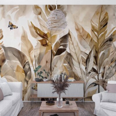 Fototapeta z dużymi liśćmi malowanymi akwarelą w odcieniach beżu, brązu i złota z motywem motyli, umieszczona w jasnym, nowoczesnym salonie.